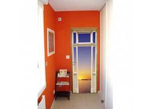 Stickers trompe l'oeil porte coucher de soleil sur la mer